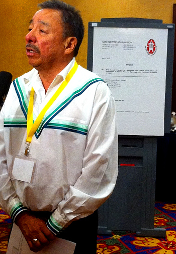 NAN Grand Chief Stan Beardy, with 'invoice' (Wawatay News)